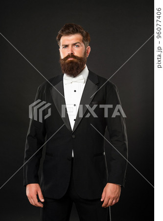 bearded businessman in tuxedo on black background, tux bearded businessman in tuxedo on black background, tux 96077406