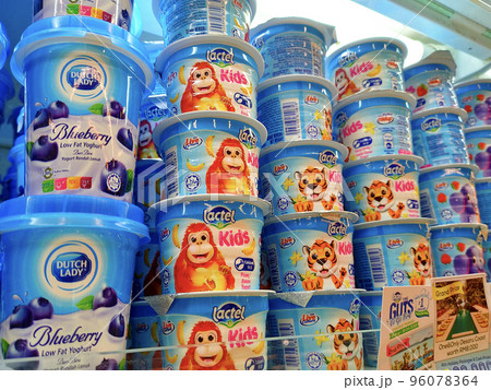 JOHOR, MALAYSIA -JULY 6, 2022: Yogurt in commercial packs. Small cup size and perfect for one serving. Sorted by brand and flavor. Labeled with a clear price tag. JOHOR, MALAYSIA -JULY 6, 2022: Yogurt in commercial packs. Small cup size and perfect for one serving. Sorted by brand and flavor. Labeled with a clear price tag. 96078364