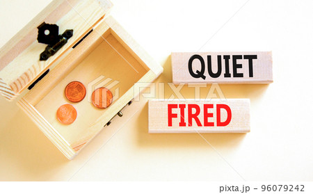 Quiet fired symbol. Concept words Quiet fired on wooden blocks. Beautiful white table white background. Wooden chest with coins. Business and quiet fired concept. Copy space. 96079242