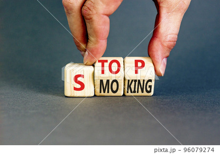 Stop smoking symbol. Concept words Stop smoking on wooden cubes. Beautiful grey table grey background. Doctor hand. Medical, healthy lifestyle and stop smoking concept. Copy space. Stop smoking symbol. Concept words Stop smoking on wooden cubes. Beautiful grey table grey background. Doctor hand. Medical, healthy lifestyle and stop smoking concept. Copy space. 96079274