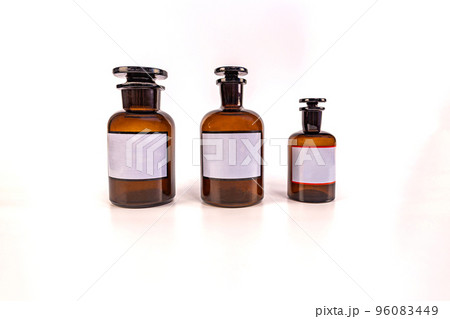 Three medical jars with glass stoppers on a white background 96083449
