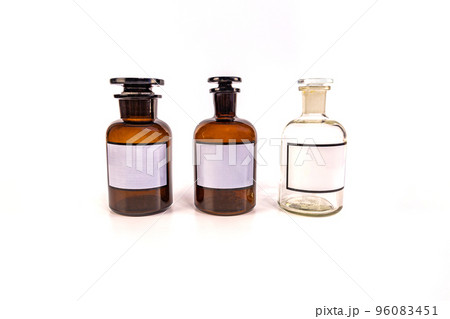 Three medical jars with glass stoppers on a white background 96083451