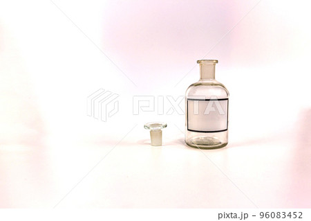 Transparent medical jar with a glass stopper on a white background Transparent medical jar with a glass stopper on a white background 96083452