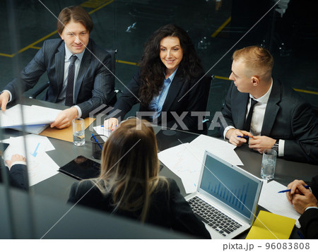Group of business people having meeting in office, viewed from above. Partners sharing ideas and planning strategy. Concept of business 96083808