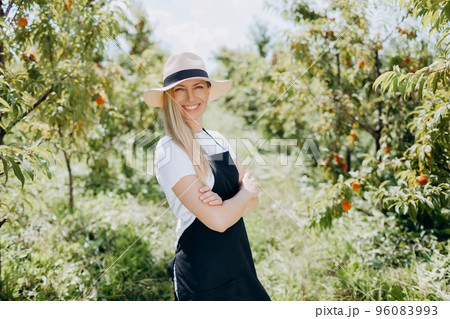 Woman posing on peach plantation 96083993