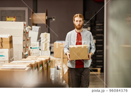Man Carrying Box at Factory 96084376