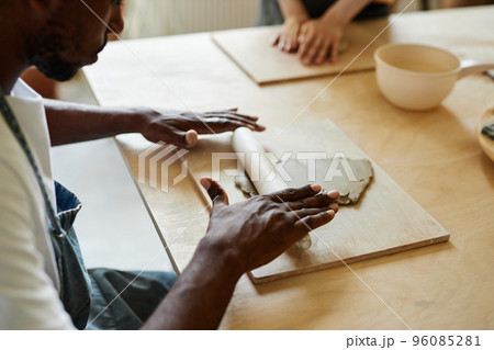 Male hands shaping clay 96085281