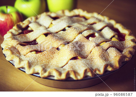 Apple pie on a wooden background, selective focus Apple pie on a wooden background, selective focus 96086587