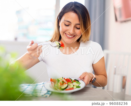 Young woman have lunch at home eating freshness salad 96088236