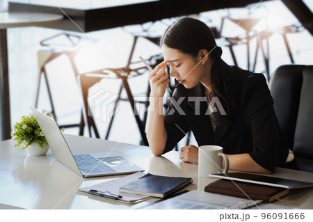 Company employees show boredom from unfinished work using computer notebook, documents and tablets at work 96091666