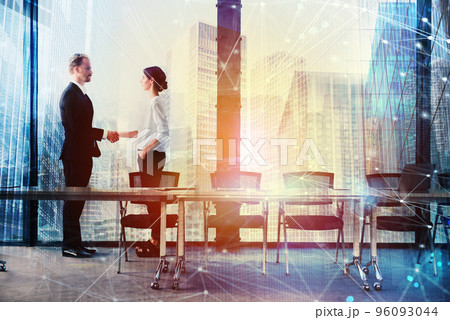 Handshake of two businessperson in office concept of partnership and teamwork 96093044