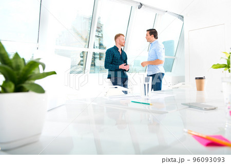 Team of businessmen work together in office. Concept of teamwork and partnership 96093093