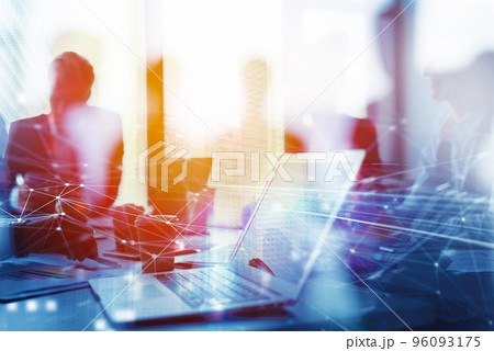 Teamwork works with a laptop. Concept of internet sharing and interconnection. double exposure 96093175