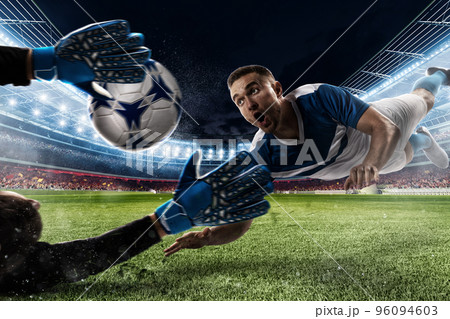 Goalkeeper catches the ball in the stadium 96094603