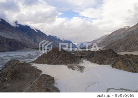 image aerial view of the vast white sand and the mountain behind at Yarab Tso Lake Nubra Valley, Ladakh 96095069