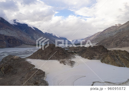 image aerial view of the vast white sand and the mountain behind at Yarab Tso Lake Nubra Valley, Ladakh 96095072