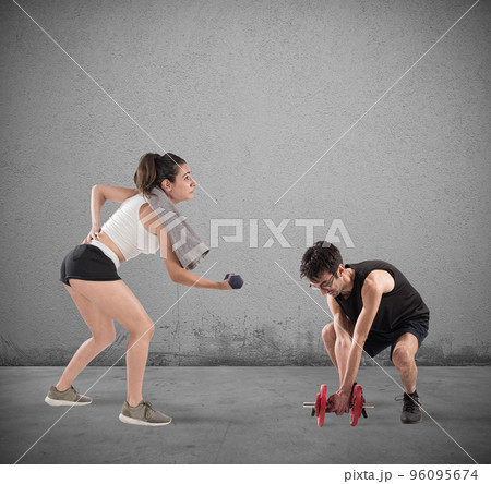 Boy and girl having difficulty at the gym Boy and girl having difficulty at the gym 96095674