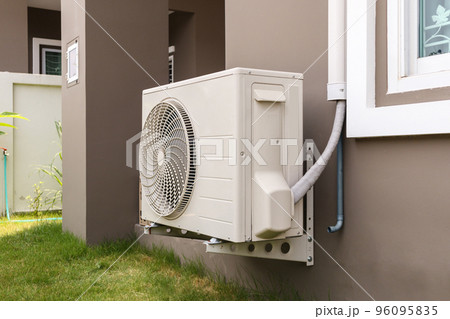 Air conditioner compressor outdoor unit installed outside the house Air conditioner compressor outdoor unit installed outside the house 96095835