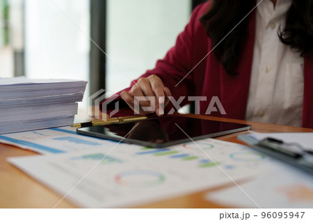 Fund managers consultation and discuss about analysis Investment stock market by digital tablet Fund managers consultation and discuss about analysis Investment stock market by digital tablet 96095947