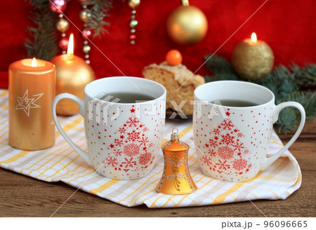 Christmas tea for two, mugs of herbal tea Christmas tea for two, mugs of herbal tea 96096665