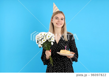 Concept of Happy Birthday with attractive girl on blue background 96097822
