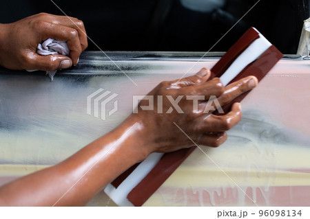 Standard auto repair shop is repairing and repainting the car after the accident. Standard auto repair shop is repairing and repainting the car after the accident. 96098134
