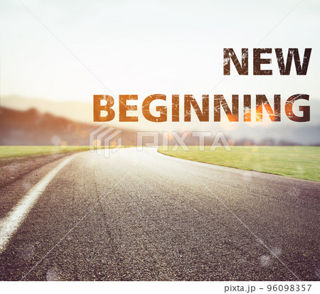 Road disappears from the view at sunset. Text new beginning 96098357
