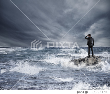 Businessman looking for the future during storm in the sea. Concept of economic crisis and problem 96098476