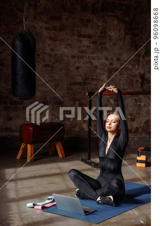Portrait of a young female online trainer Portrait of a young female online trainer 96098668