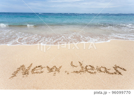 New Year written on the sand on the beach 96099770