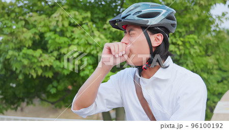 man cough riding bike 96100192