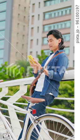 man using phone commuting man using phone commuting 96100197