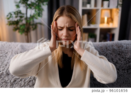 Sad woman suffering from headache 96101656