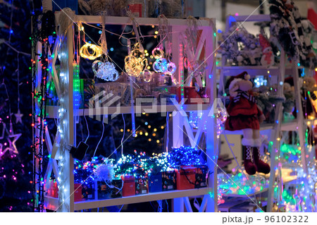 Christmas market. Christmas garland, souvenirs and toys for decoration in store. 96102322