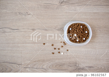 Dry food with vitamins for cats and dogs. Top view. 96102567