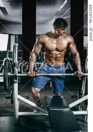 Male bodybuilder, fitness model trains in the gym 96102569