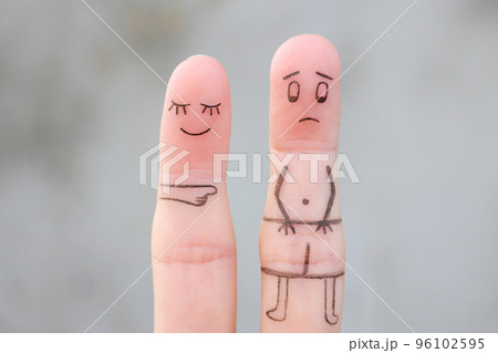 Fingers art of the wife laughs at her husband. Concept of impotence. Divorce. Fingers art of the wife laughs at her husband. Concept of impotence. Divorce. 96102595