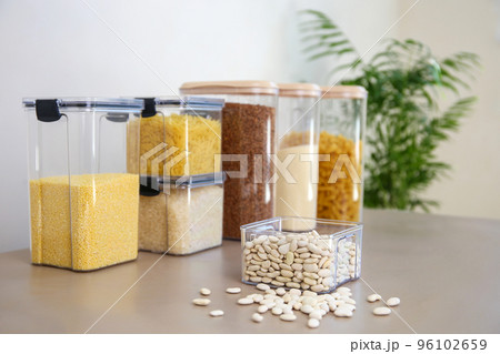 Containers for storing bulk products in the kitchen. Selective focus on a can of beans. 96102659