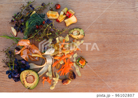 Domestic waste for compost from fruits and vegetables on the table. Flat lay. Top view. Domestic waste for compost from fruits and vegetables on the table. Flat lay. Top view. 96102807