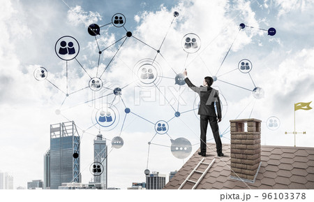 Businessman on house roof presenting networking and connection c 96103378