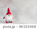 Christmas handmade gnome in red hat holiday banner on light winter background 96103468