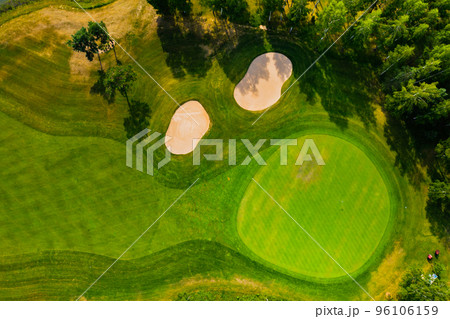 Top view of the golf course located in a wooded area 96106159