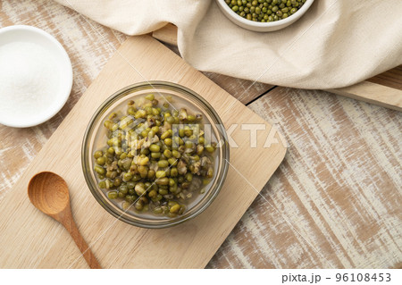 Green Beans in Syrup in glass bowl,Thai Dessert on wooden table.Top view 96108453