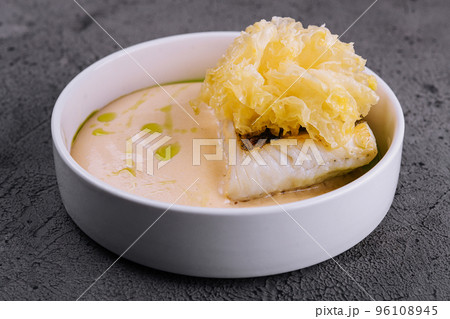 fried cod fish filet with sauce hollandaise fried cod fish filet with sauce hollandaise 96108945