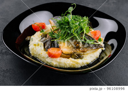 Fried norwegian skrei cod fish filet with mashed potatoes Fried norwegian skrei cod fish filet with mashed potatoes 96108996