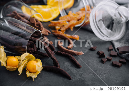 Stack of chocolate sticks on black stone 96109191