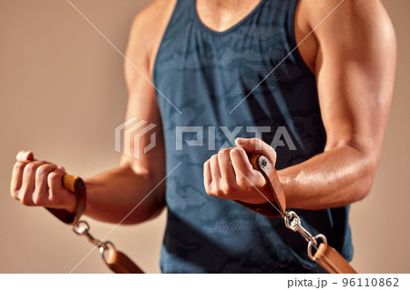 An athletic man does an exercise on a reformer in the gym. No face. Feet close-up on the reformer. Pilates. The concept of a healthy. High quality photo 96110862