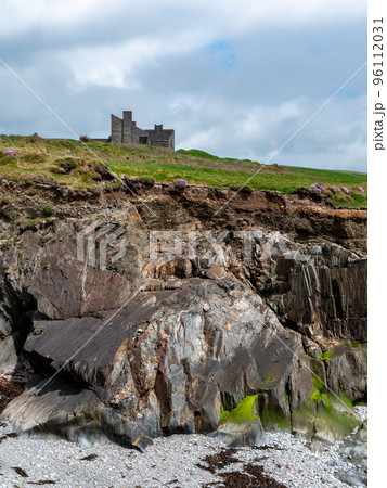 An abandoned building on a hill. Rocky cliff. Beautiful stones, landscape. 96112031