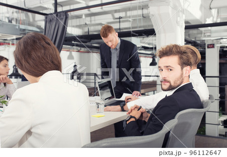 Business people that work together in office. Concept of teamwork and partnership Business people that work together in office. Concept of teamwork and partnership 96112647