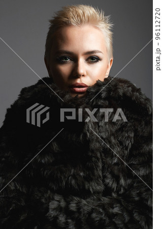 young short blond hair woman in fur. beautiful girl young short blond hair woman in fur. beautiful girl 96112720